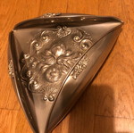 Decorative triangular vessel used with embossed flowers