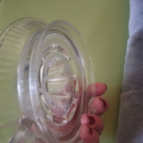 Glass lemon squeezer used