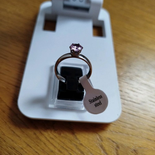Stainless steel solitaire ring new with purple stone, size 18