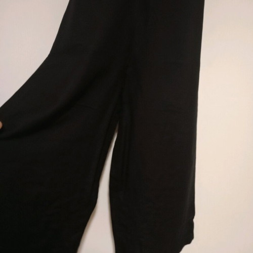 Black one-piece jumpsuit like new, deep neckline and back tie, size S