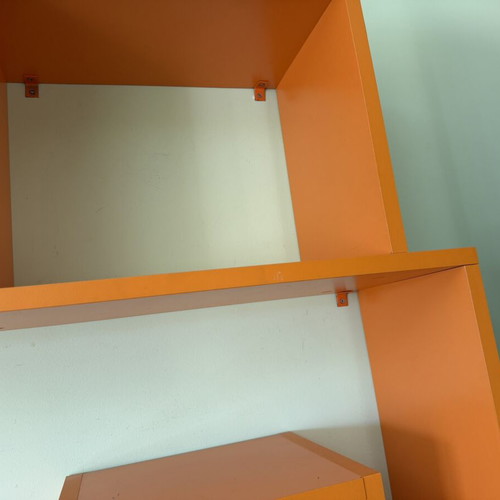 Modern orange wall shelf unit for kids or office