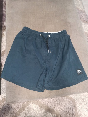 Boys' swim shorts blue like new, age 14