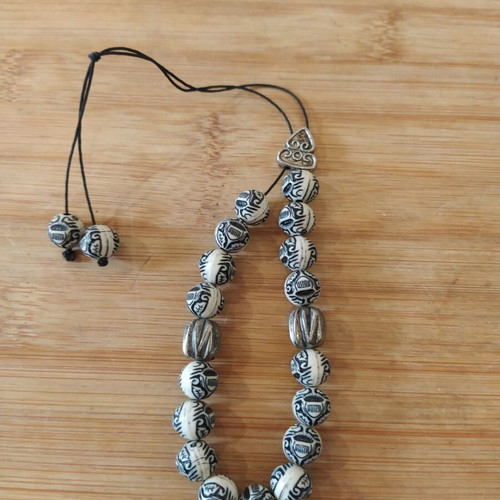 Worry beads white-black with embossed designs like new