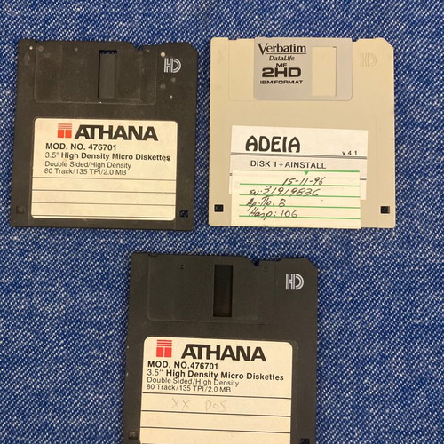 Vintage pack of used floppy disks and cassettes with 8-track and VHS