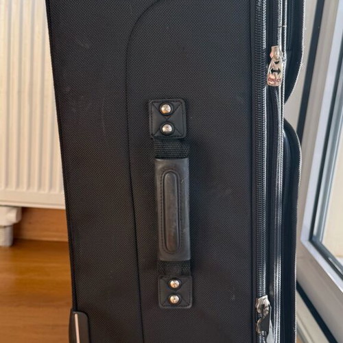 Delsey Black Medium Suitcase used with wheels