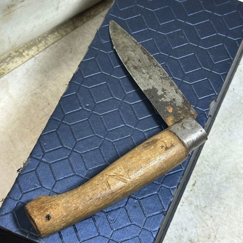 Vintage folding pocket knife with wooden handle used