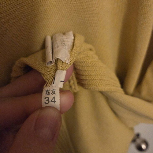 Yellow spring blouse used, size small with buttons on back