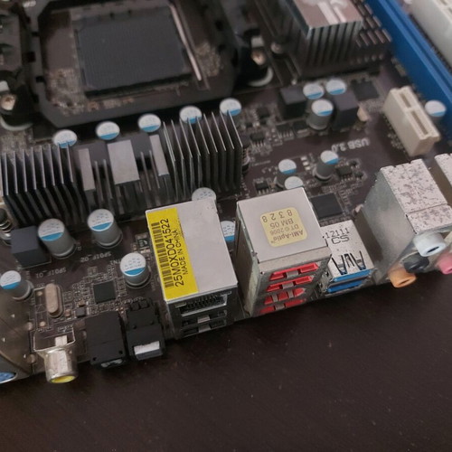 AsRock 970 Extreme4 AM3+ motherboard used, functional with updated BIOS