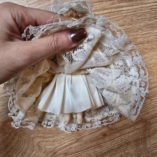 Glass bride doll like new with hat and lace