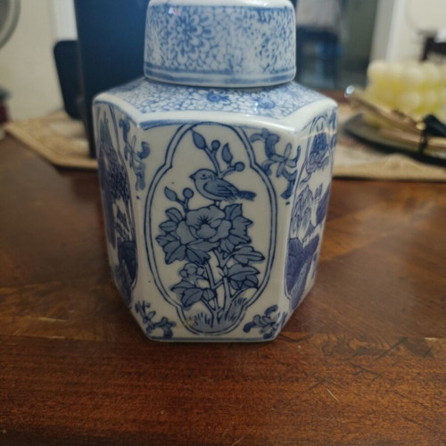 Hexagonal decorative vase with scenes