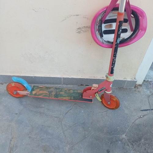 Scooter with helmet used, fully functional