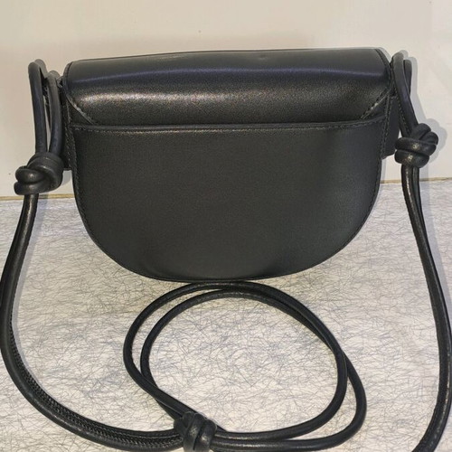 Dkny black leather crossbody bag like new with knot design strap