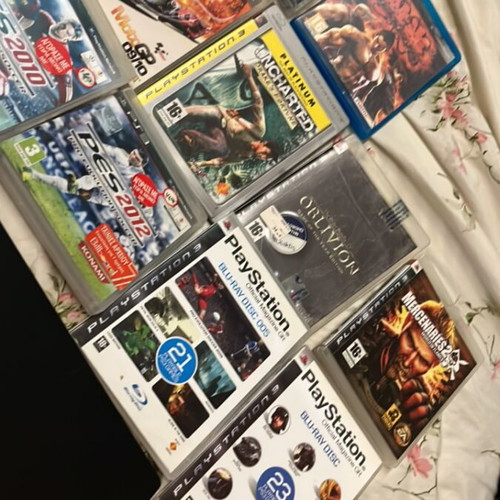 PlayStation 3 Slim console like new with 9 games and 2 demo discs