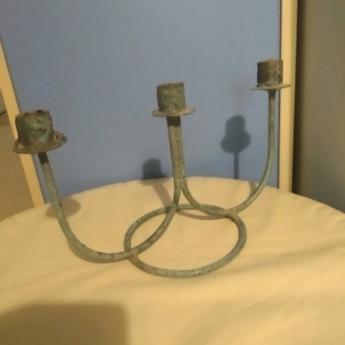Vintage three-arm candlestick made of patinated brass like new