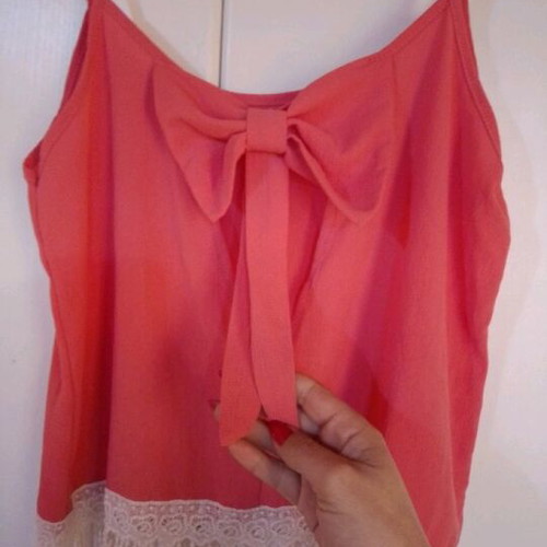 Blouse new with bow back and fringes bottom size L