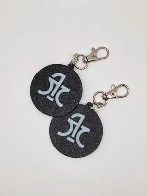 Logos Timis keychain set of 2 new, black and white