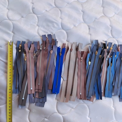 Metal and plastic sewing zippers YKK, assorted colors and sizes, pack