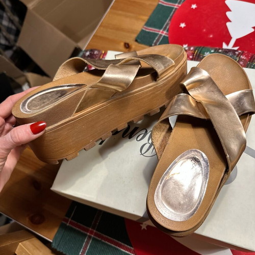 Gold flatforms used with thick treaded sole and wide straps