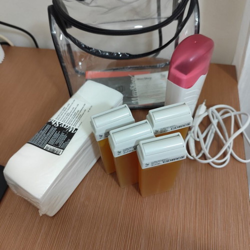 Waxing Kit like new with wax cartridges and strips