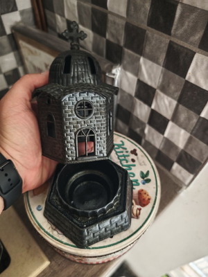 Candle holder used, church-shaped without glass cup, black