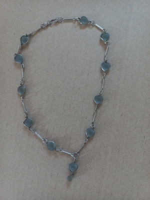 Silver necklace with translucent grey/ciel heart stones and pendant, used
