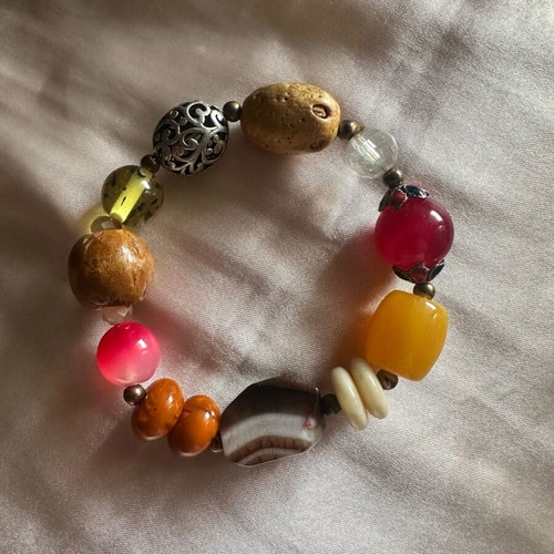 Bracelet like new with colorful elements including wood