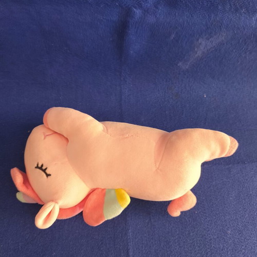 Pink plush unicorn with colorful wings