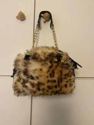 Leather bag with natural fur like new, handheld