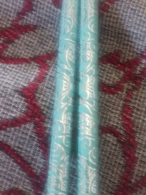 Set of 2 light green pencils with designs