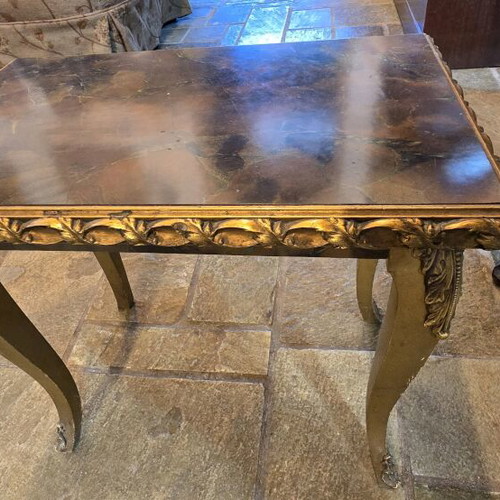 Vintage gold side table used with gilded details