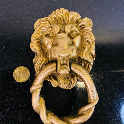 Bronze door knocker used with lion head and wooden base