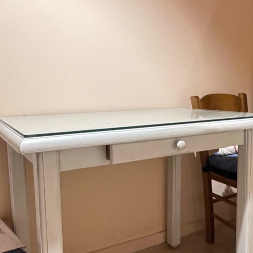 Wooden desk with glass surface and drawer used