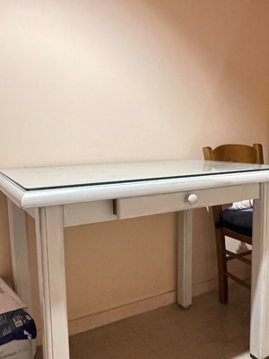 Wooden desk with glass surface and drawer used