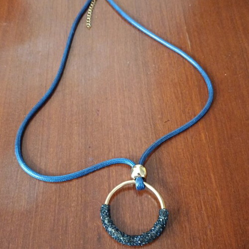 Necklace with blue cord like new with unique pendant