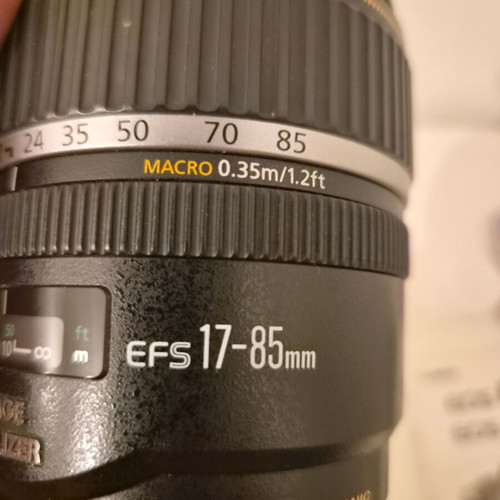 Canon EOS 450D camera used with 17-85mm zoom lens and accessories