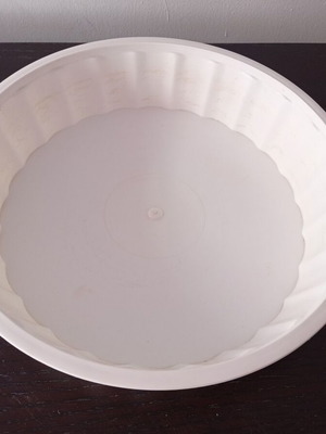 Plastic white round wavy tupperware used