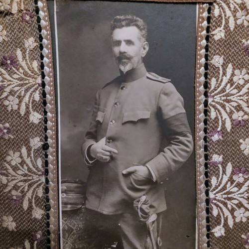 Old military photograph on embroidered frame used