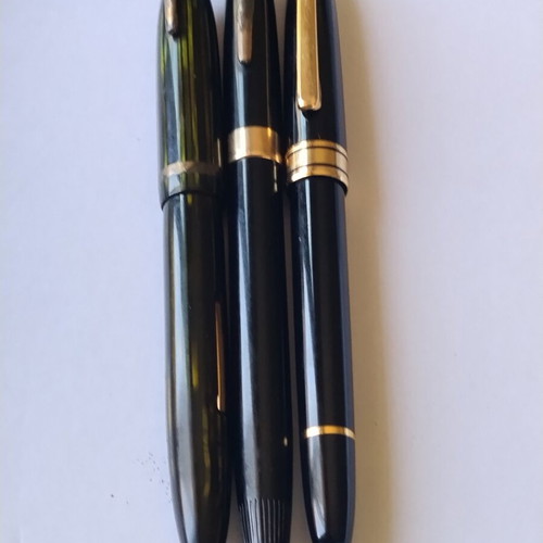 Sheaffer's vintage fountain pen set with 14K gold nibs and desk base, used