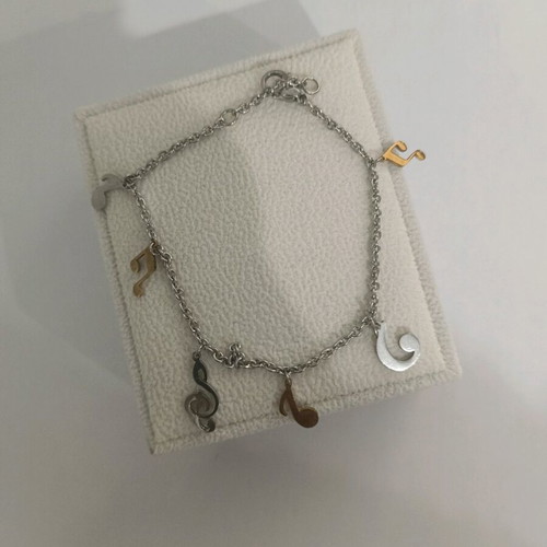 Bracelet with musical notes like new, silver