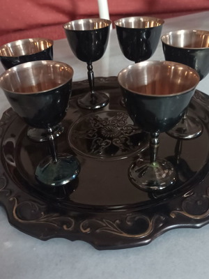 Decorative tray with six liqueur glasses used, metal