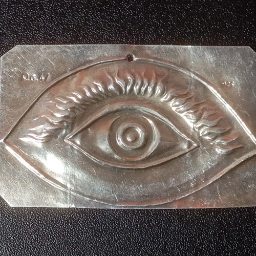 Silver votive with eye depiction used