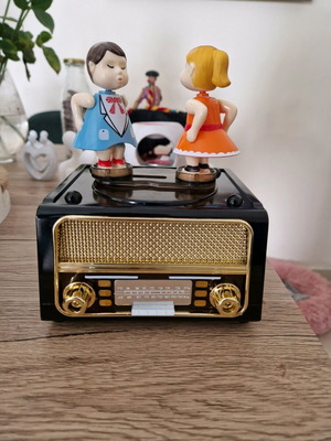 Music box new with boy and girl giving a kiss
