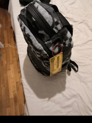 Sprayground collectible backpack, black and grey