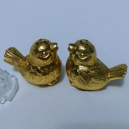 Set of gilded miniature salt and pepper shakers with lead tray
