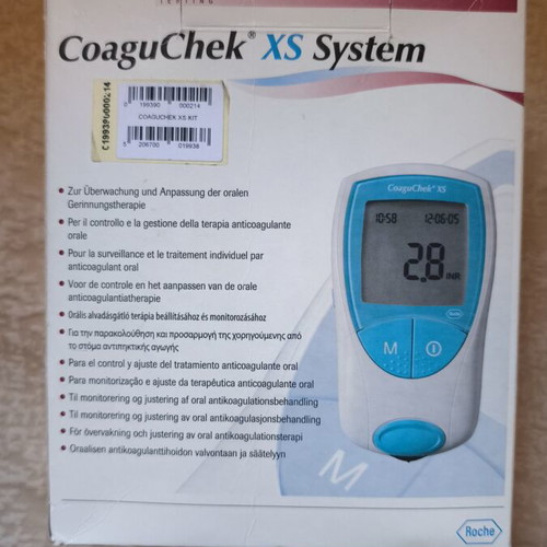 CoaguChek XS System INR meter used with original packaging and accessories