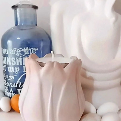 Handmade ceramic tulip-shaped tealight holder in pastel pink ombre