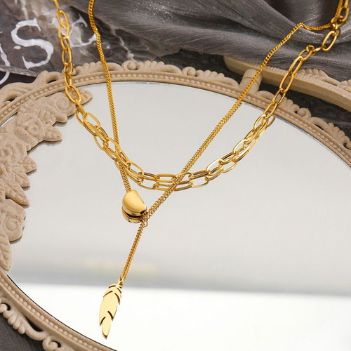 Feather necklace in gold color new stainless steel
