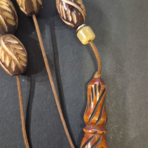 Komboloi carved bone, new, 23 beads 11×16mm