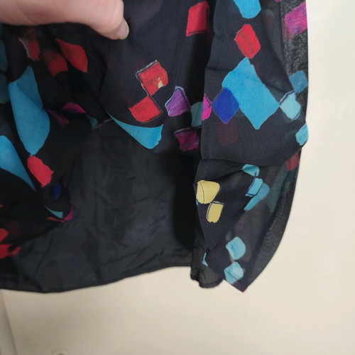 Small pleated skirt like new, black multicolor