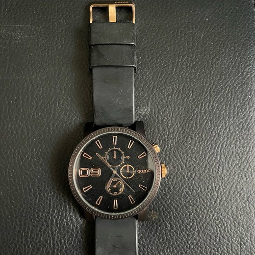 Ouzoo watch used for parts or repair